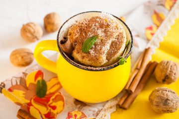 coconut cake in a cup on a table, selective focus