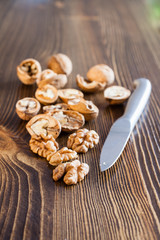 walnuts and knife on a table, selective focus