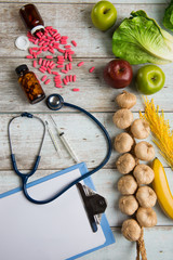 healthcare concept balance between medicine and healthy foods