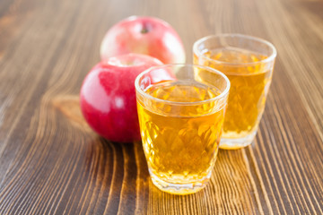 apples and juice on a table, selective focus