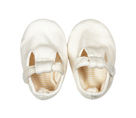 Children's wear -  Cotton elegant kid's newborn baby shoes, bootees, isolated on the white