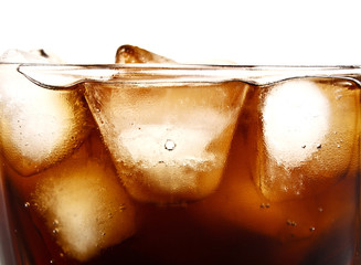 Cola in glass with ice cubes on white background