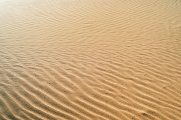 Background waves of sand of orange color