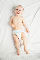 Adorable baby sitting over white background