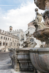 Fototapeta na wymiar The Neptune fountain in Cathedral Square, Trento, Italy