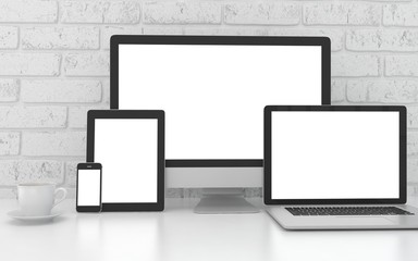 Responsive mockup screen. Monitor, laptop, tablet, phone on table in office. 3d rendering.
