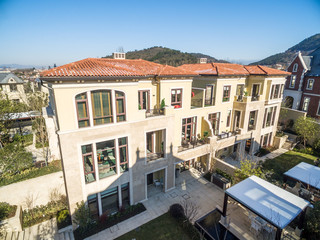 Fototapeta na wymiar aerial view of houses of modern villa in sunny day