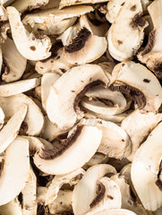 Photo of mushrooms champignon sliced for background or texture,