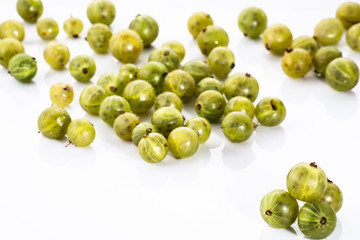 Gooseberries fruits on white background. Ripe summer fruits back