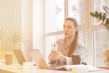 Surprised freelance woman