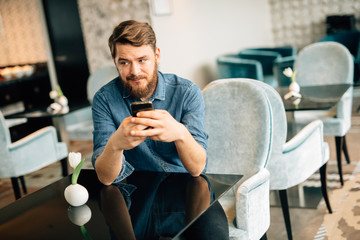 Man waiting for woman in restaurant