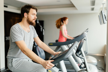 Fototapeta na wymiar People cardio exercising in gym