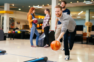 Happy people bowling