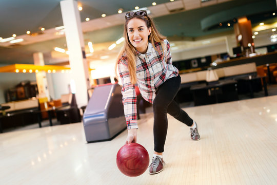 Woman throwing bowling ball
