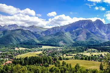 Fototapeta na wymiar Landscape of Tatra Mountains, view at Zakopane from the top of Gubalowka
