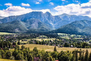 Naklejka na ściany i meble Landscape of Tatra Mountains, view at Zakopane from the top of Gubalowka