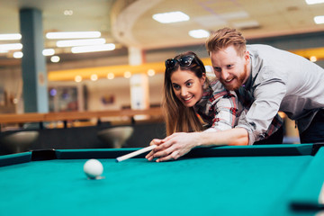 Couple dating and playing snooker
