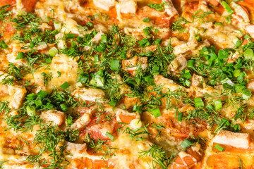Obraz na płótnie Canvas Pizza with chicken, onion, cheese and greens as background or texture of food