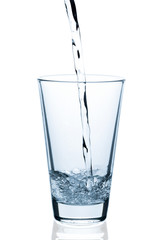 pouring water into empty glass