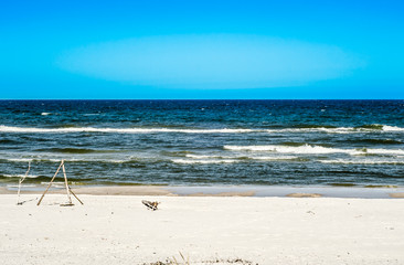 Fototapeta na wymiar Landscape with sea view, sandy beach and summer blue sky