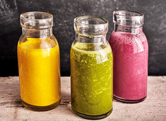 Three healthy fresh vegetable and fruit smoothies