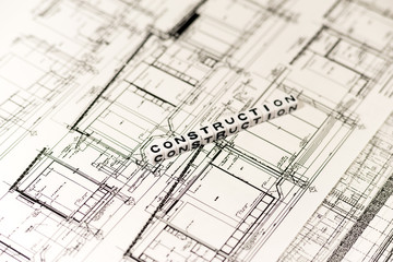 Construction drawing and CONSTRUCTION on white cube