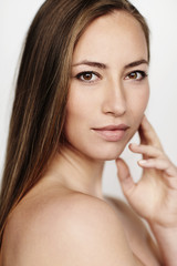 Fototapeta premium Brown eyed beautiful woman looking at camera