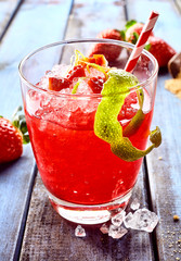 Glass of red ice slush drink close up