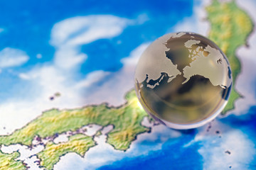 Fototapeta premium Crystal globe on map of Japan
