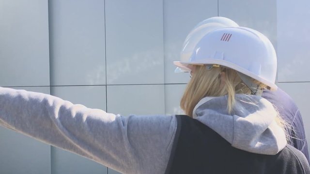 View of a Worker and enginner checking last details before delivery
