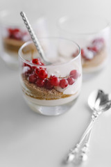 Decorated dessert with red berries in a glass for weddings, birthdays and events