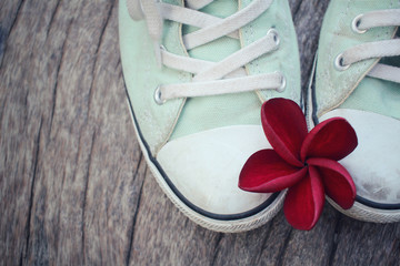 Sneakers with red flower