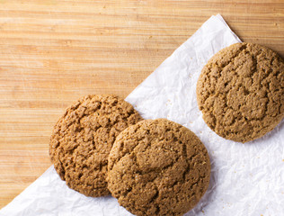 Healthy oat round cookies laying on wooden table
