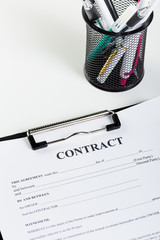 Business contract document with pen