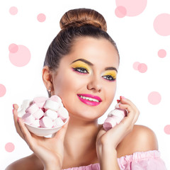 Obraz na płótnie Canvas Beauty fashion model girl with colorful makeup with sweets. Diet,dieting concept. Sweets. Colorful background.