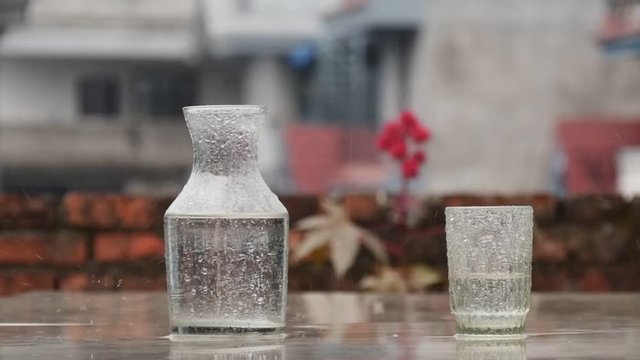 Rain hit the table in slow motion