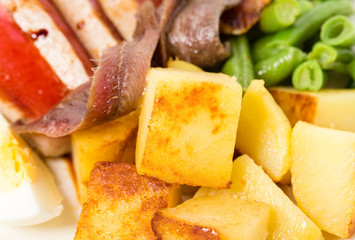 Delicious nicoise salad with anchovies and potatoes.