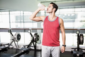 Fototapeta premium Standing man drinking water