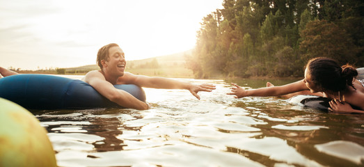 Loving young couple having fun in the lake