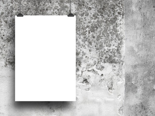 Close-up of one blank frame hanged by clips against grey stained concrete wall background