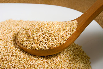 quinoa grains on a wooden board closeup
