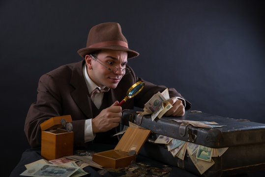 Numismatist with his coin collection