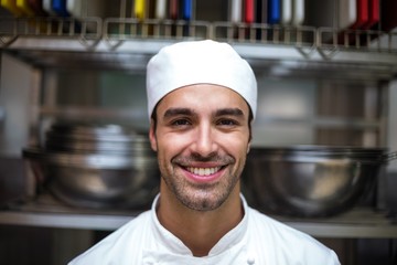 Handsome chef looking at camera