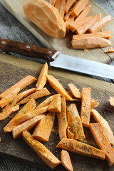 Fresh cut slices of sweet potatoes made into fries with herbs