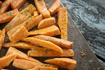 Fresh cut slices of sweet potatoes made into fries, ready for co