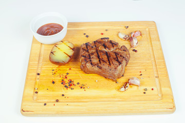Club Beef steak with pepper sauce and Grilled vegetables on.