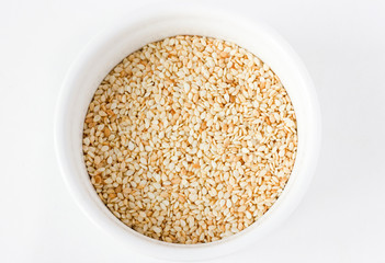 Sesame seeds on white background