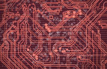 abstract image of microcircuit against a red background close up