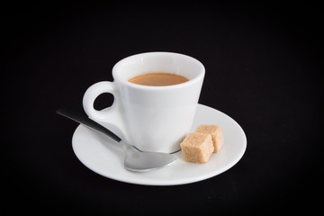 Espresso with spoon and sugar cubes