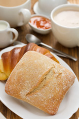 bread with coffee on brown wooden background